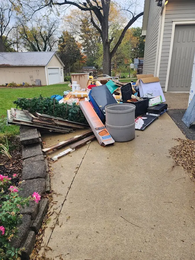 Dumpster being loaded with debris for Commercial Dumpster Rental in Oak Hills